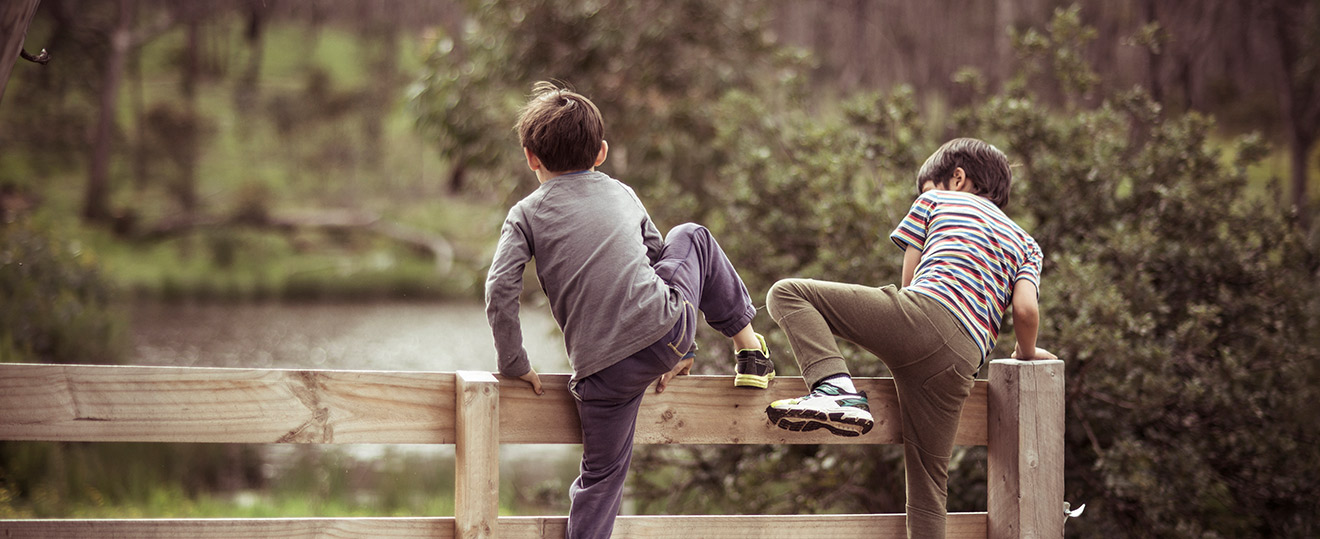 Boys crossing a boundary